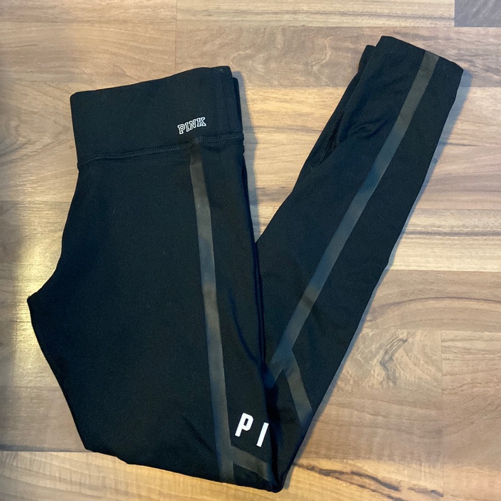 PINK - Black leggings.